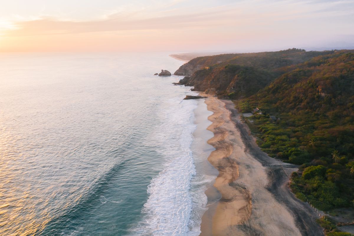Aerial view of the Mexican Pacific coast with deep blue ocean and dramatic cliffs