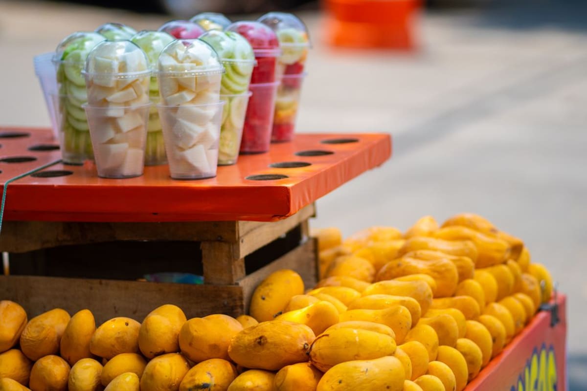 Fresh tropical fruit including mango at a Mexican market stall near Puerto Escondido