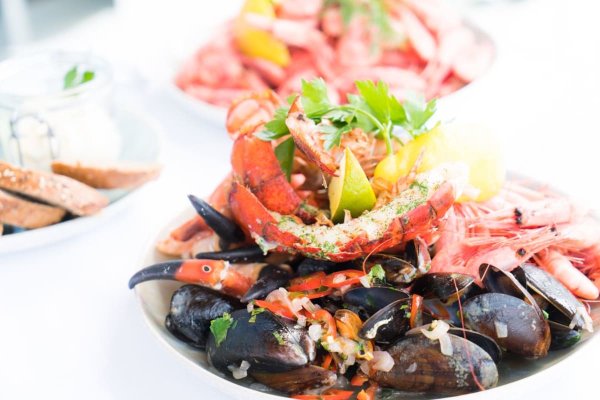Vibrant seafood platter with lobster, mussels and shrimp served at a Puerto Escondido seafood restaurant on the Pacific
