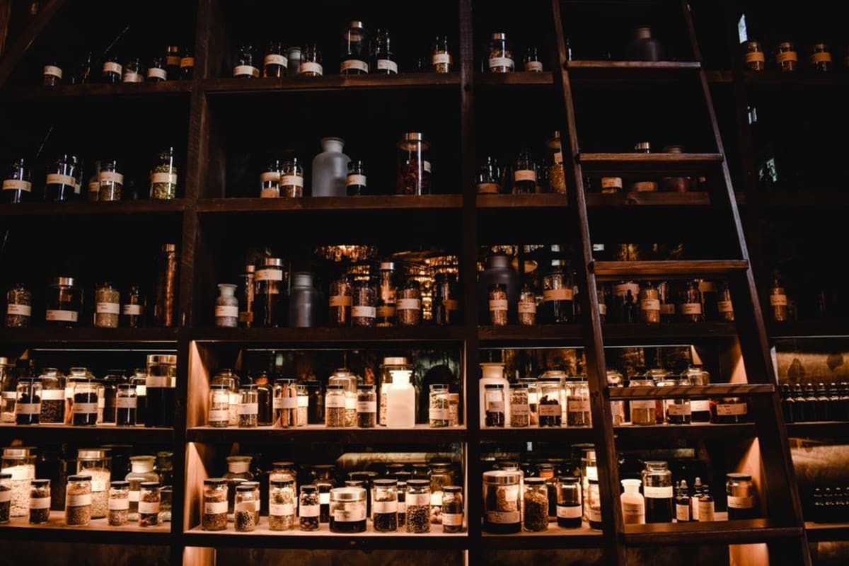 Well-stocked farmacia shelves lined with medicine boxes in Mexico — hundreds of OTC medicines available without a prescription in Puerto Escondido
