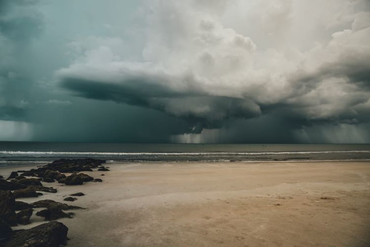 Storm clouds gathering over a tropical beach in Puerto Escondido Oaxaca during the summer rainy season