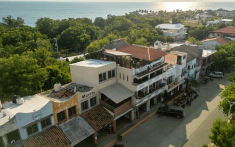 The tree-lined boulevard of Rinconada with ocean views