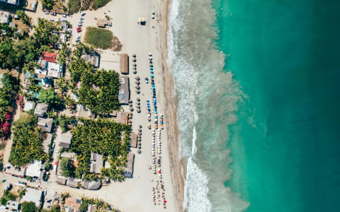 Aerial view of Puerto Escondido bays and coastal jungle, Oaxaca, Mexico