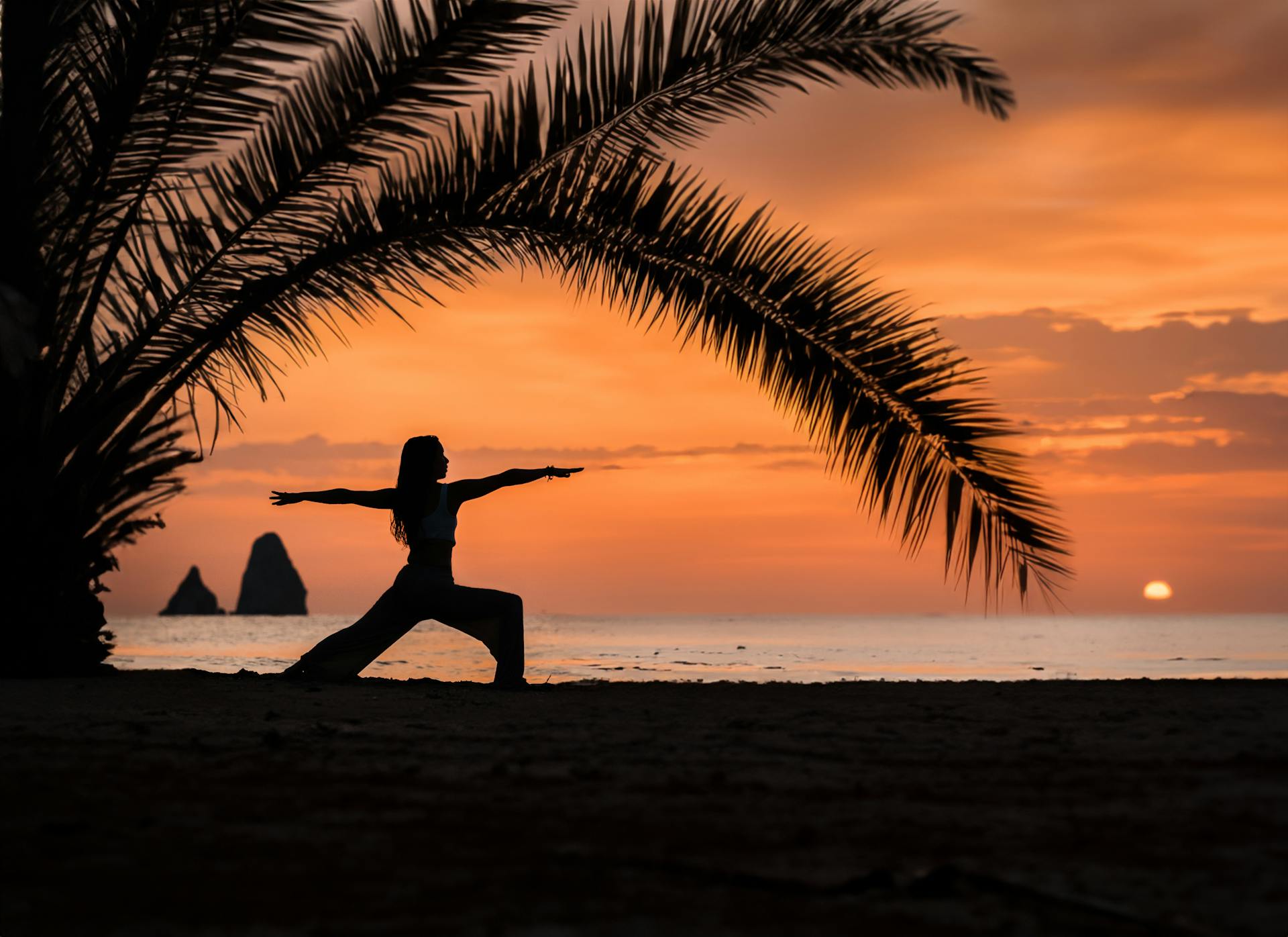 Yoga on a tropical beach at sunset in Puerto Escondido