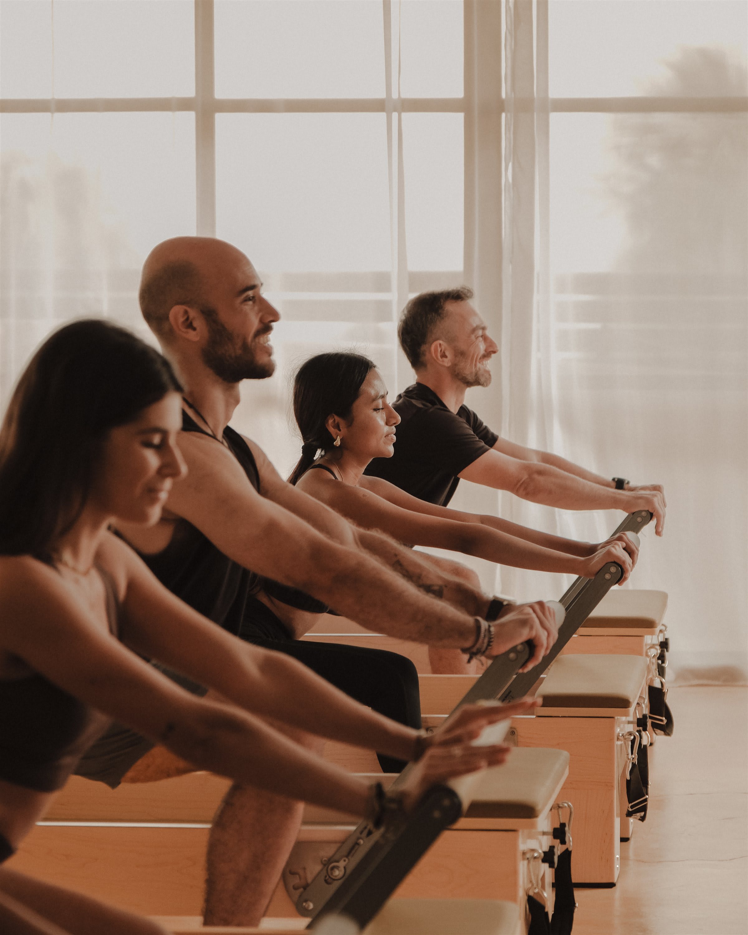 Pilates Reformer group session side view, Agata Studio Puerto Escondido