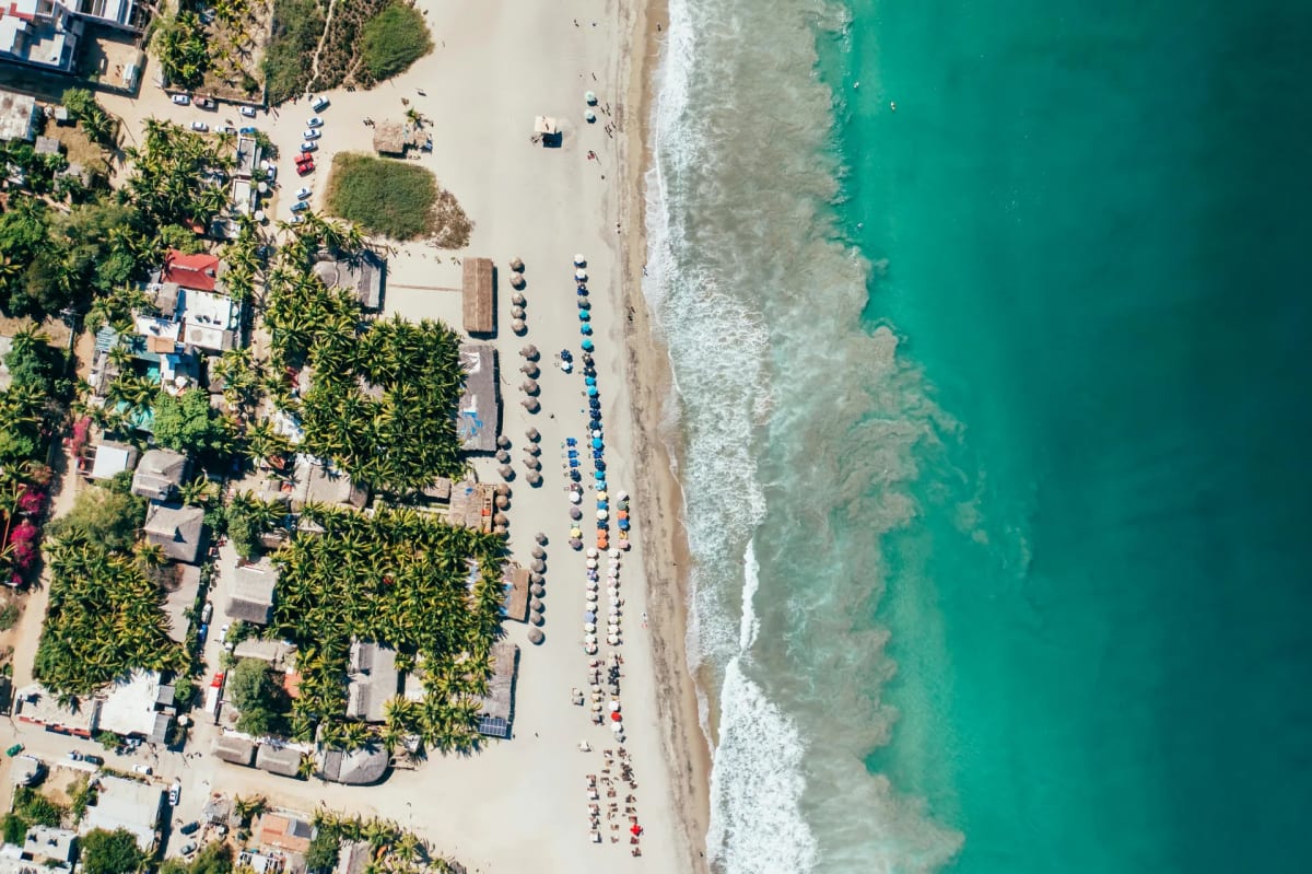 Aerial view of Puerto Escondido beaches with Pacific Ocean waves and the Oaxacan coastline