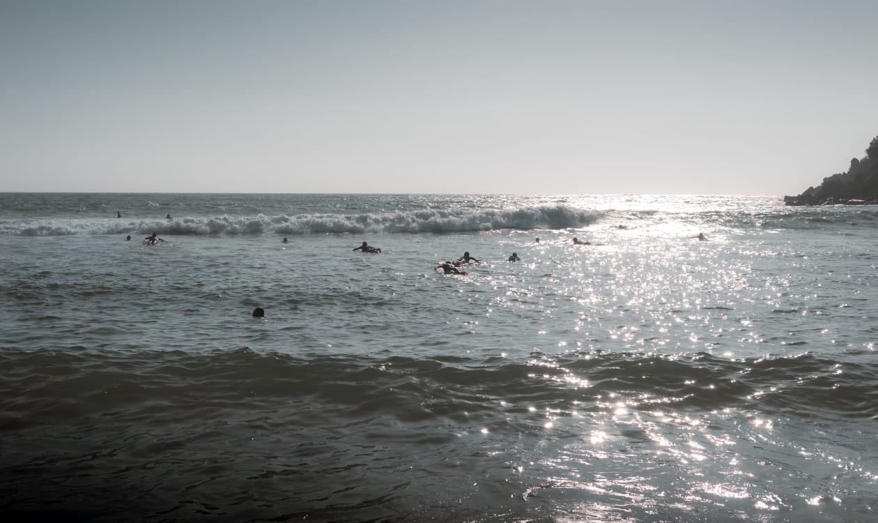 Surfers enjoying the sparkling ocean waves at Puerto Escondido, Mexico during the October surf season