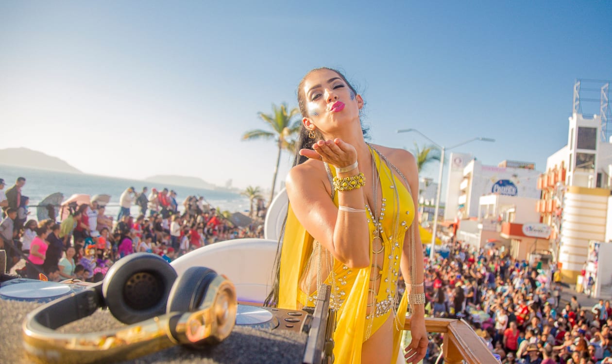 Lively beach festival atmosphere in Puerto Escondido in April with crowds and vibrant seaside celebration