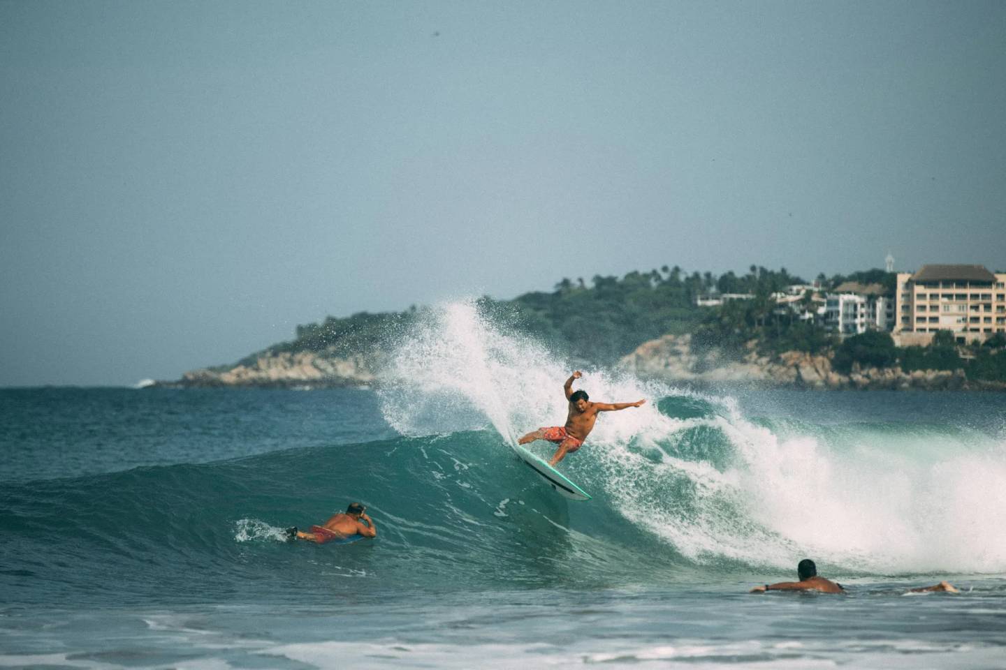 Surfer riding a massive wave at Playa Zicatela, Puerto Escondido