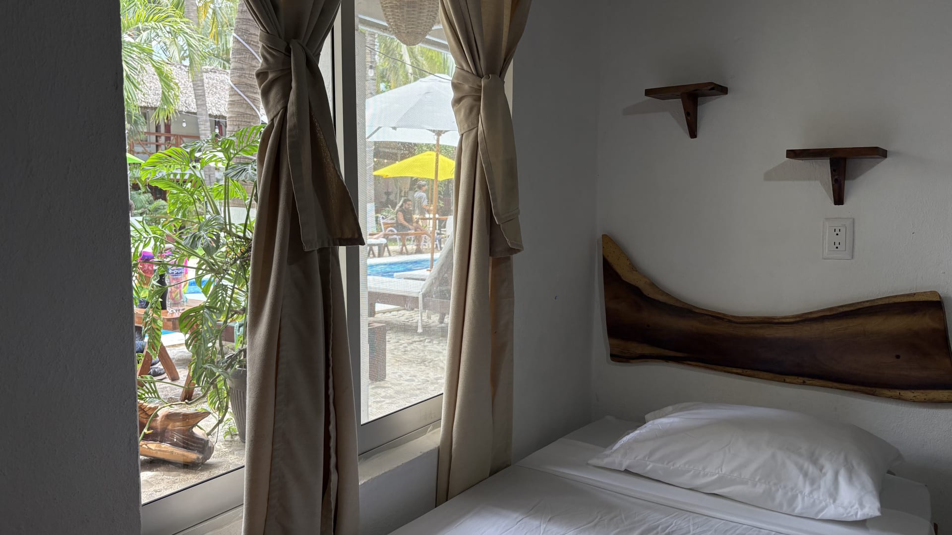 Room with view of the pool and tropical garden