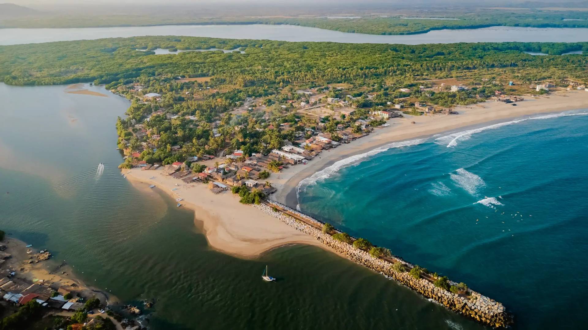 Aerial view of Chacahua Lagoon with the village, pristine beach, and Pacific Ocean