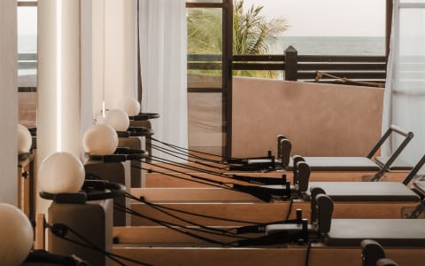 Agata Pilates Studio ocean view — Reformer machines with Pacific Ocean in the background, Zicatela Puerto Escondido