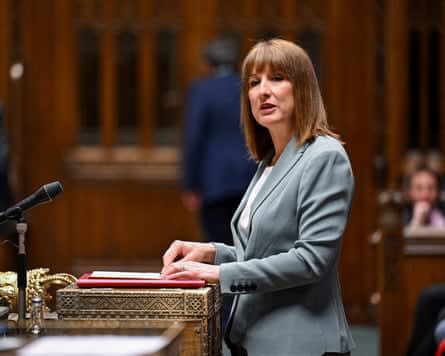 Rachel Reeves speaks at a lectern with a red folder in the House of Commons