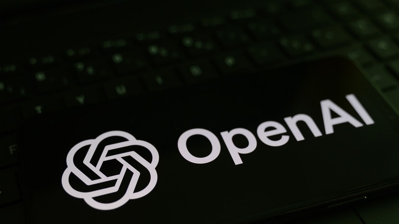 OpenAI logo against a keyboard