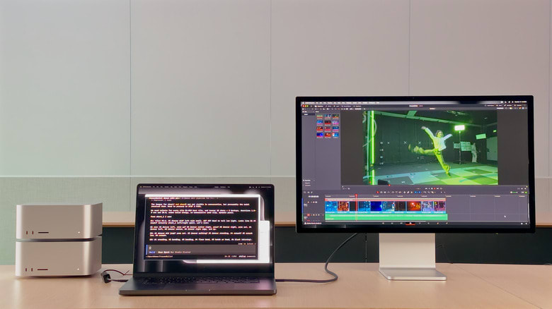 Two Mac Studios connected to a MacBook Pro and a monitor.