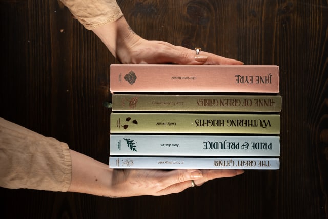 stack of Wordsworth Editions illustrated books held in both hands