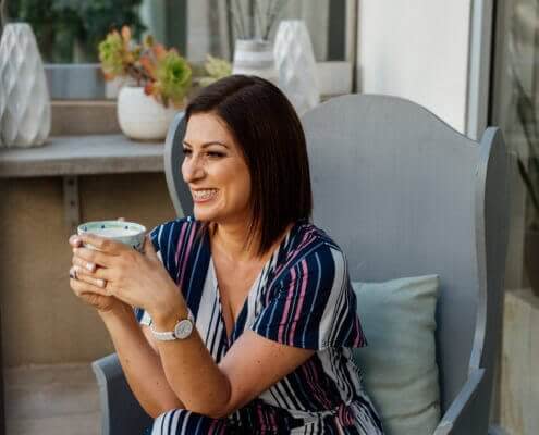woman drinking tea in balcony woman drinking tea in balcony
