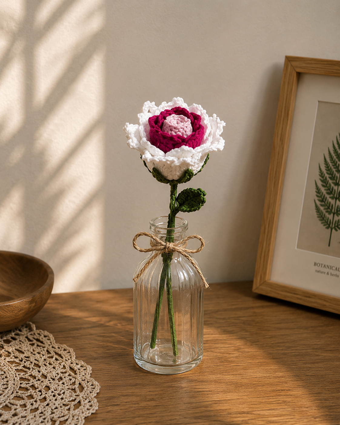 Luxury pink and white crochet rose bouquet in a clear glass vase, realistic handmade floral arrangement for home decor, living room styling, office desk decoration, and unique gift ideas.