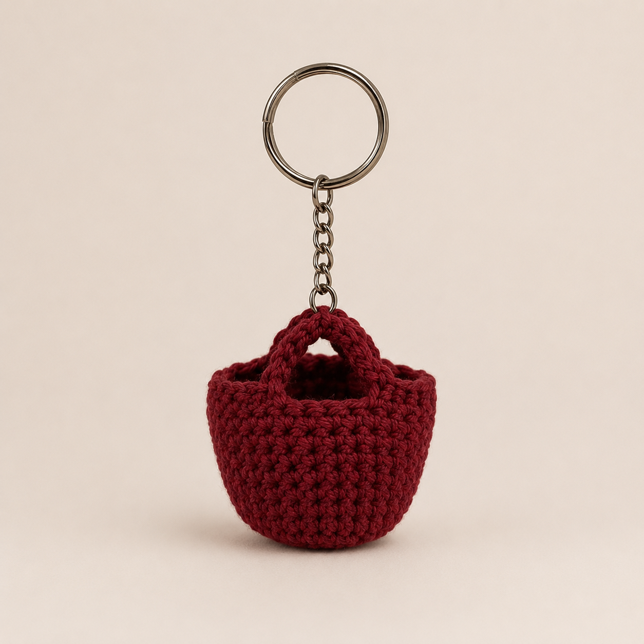 Ruby Basket Keychain product photo, deep red mini basket charm with metal keyring and chain on a plain background.
