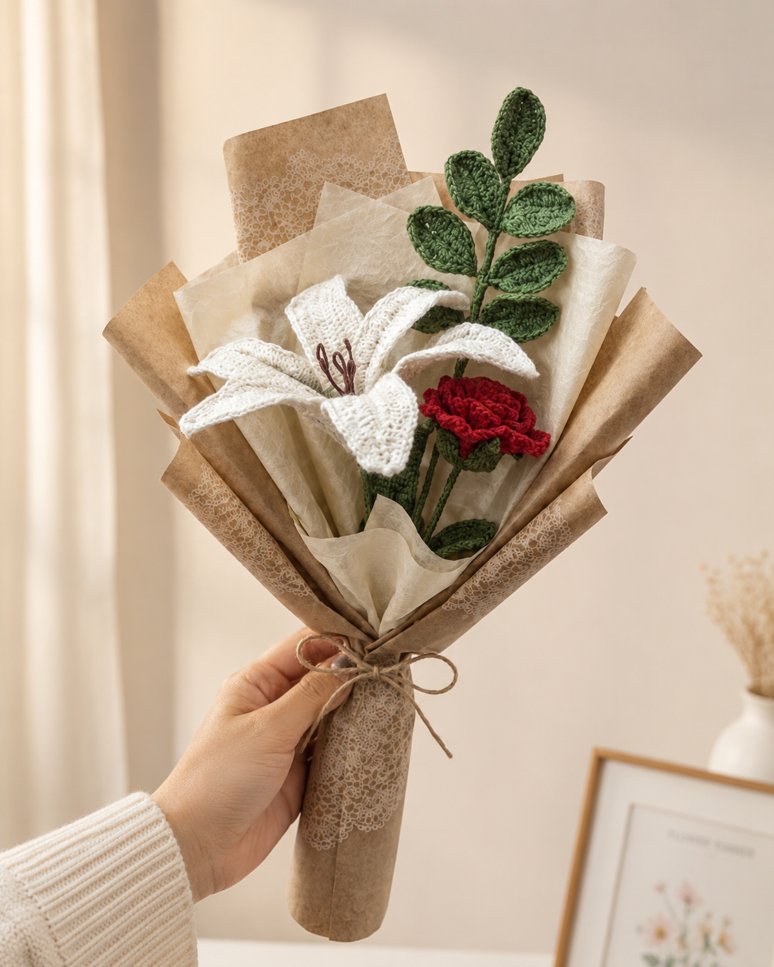 Lily & Rose Gift Bouquet with white lily, red rose, green leafy stems, kraft paper wrapping and ribbon tie, held in hand as a long-lasting flower gift for birthdays, anniversaries, weddings and special occasions.
