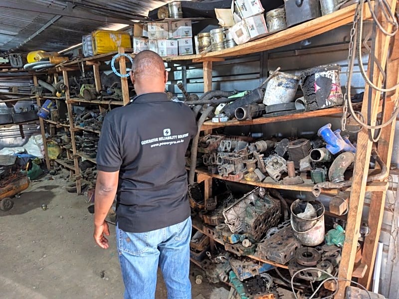 Technical Team Handling On-Site Generator Repairs