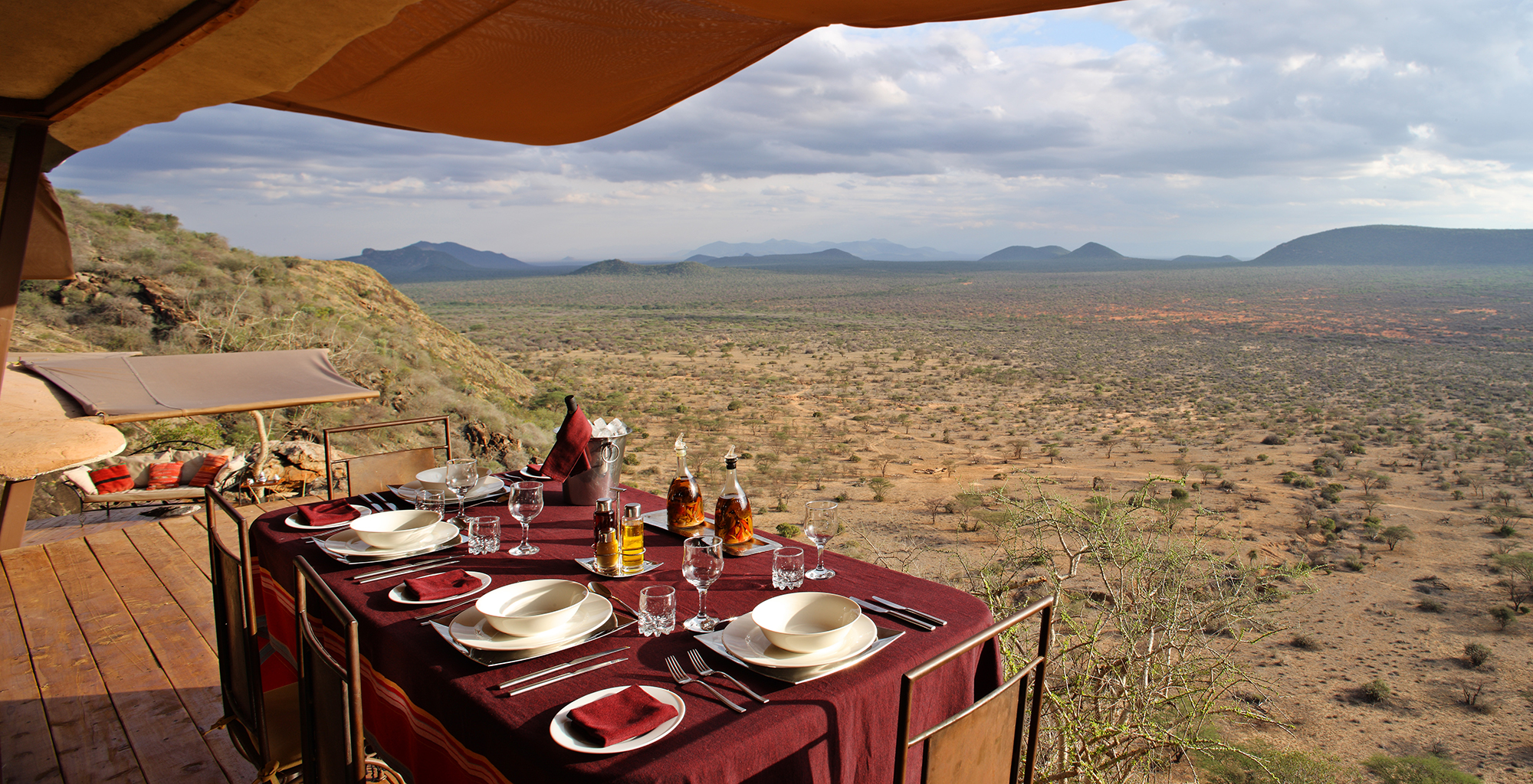 Stunning luxury safari lodge overlooking the African savannah at sunset