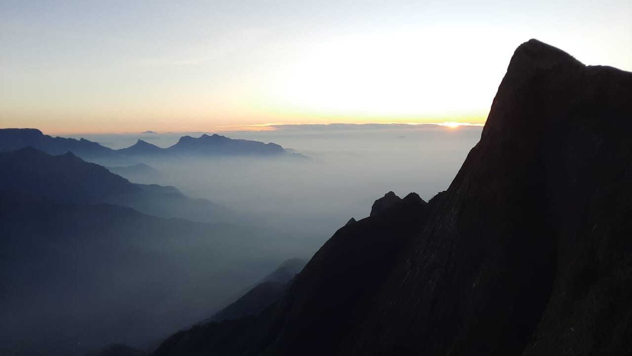 Stunning pink purple sunset sky at Camp Lake Point Munnar Kerala