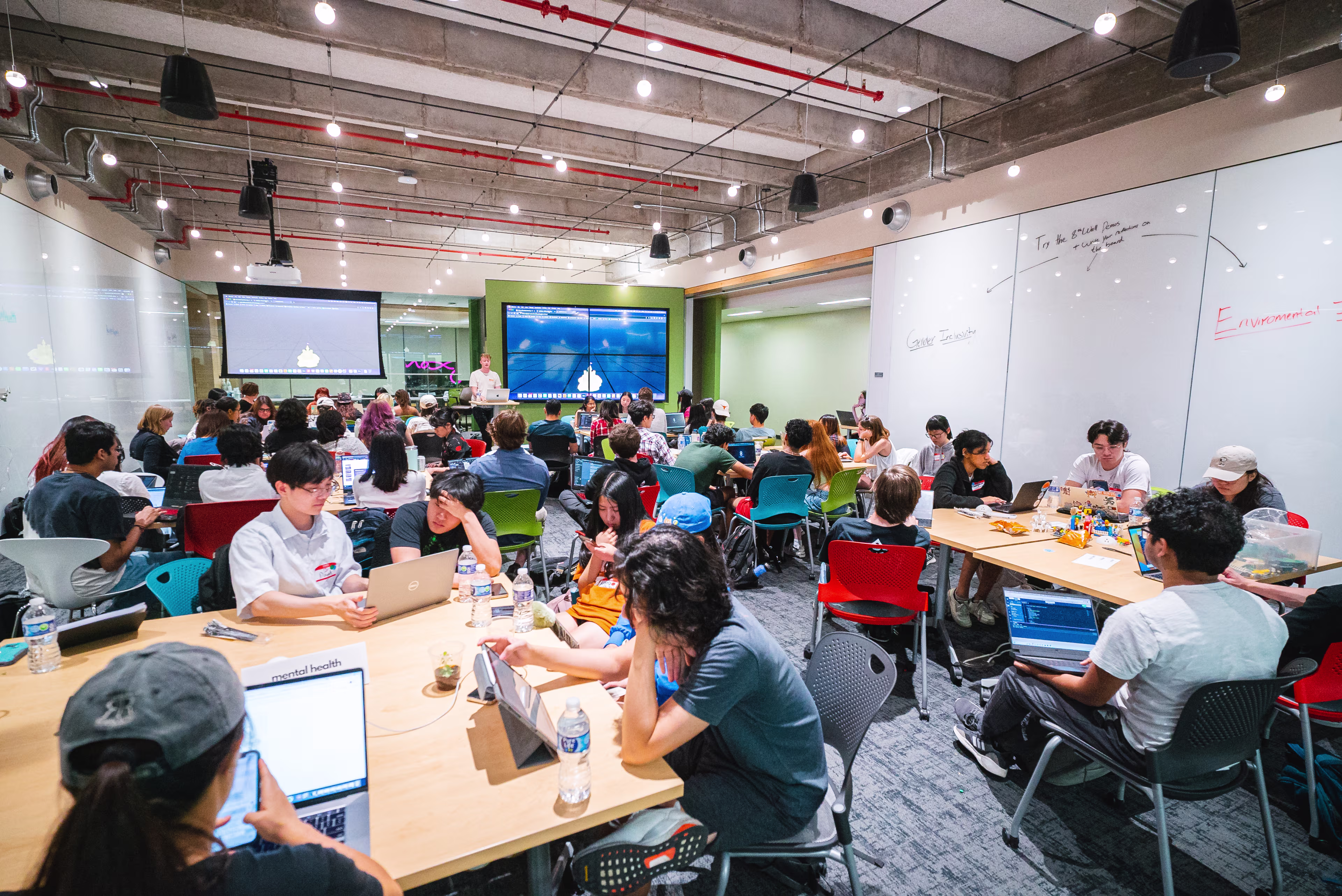Students collaborating during TXI Buildfest