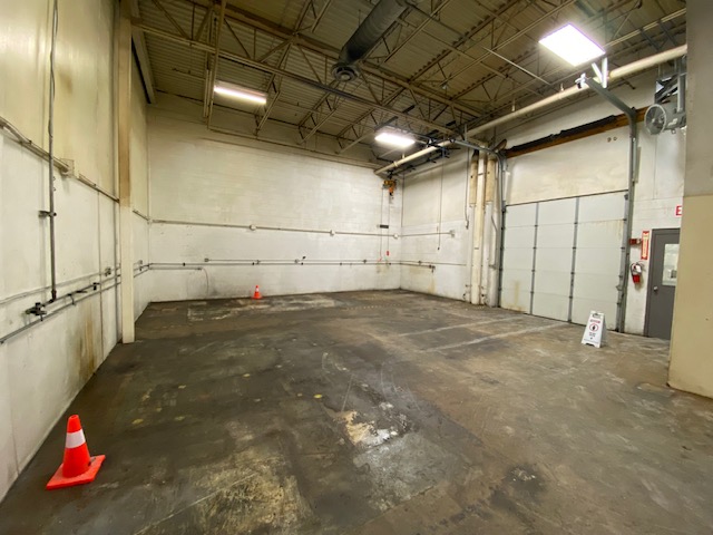 Marvin Composites warehouse floor before cleaning