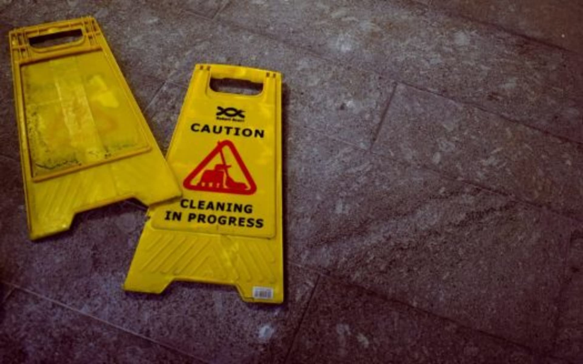 Commercial cleaning supplies staged in a facility corridor for scheduled service