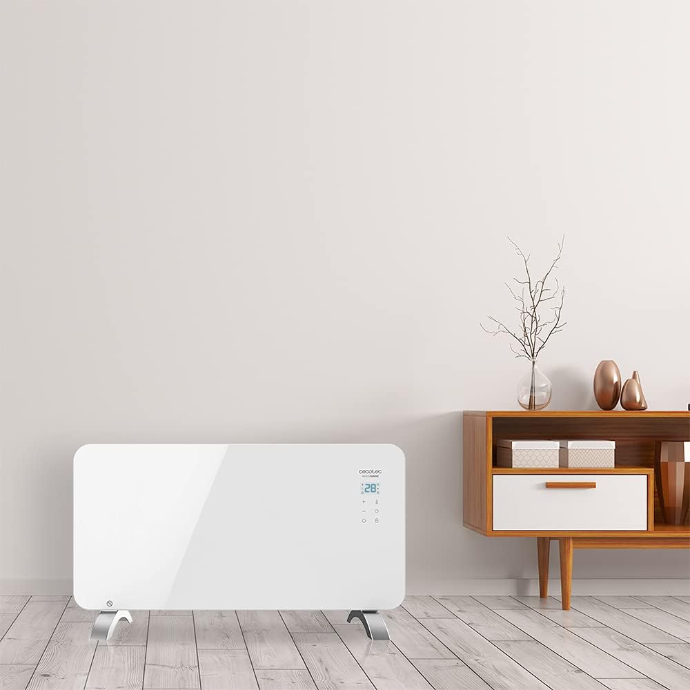 Radiador eléctrico Cecotec en un interior moderno con mueble decorativo.