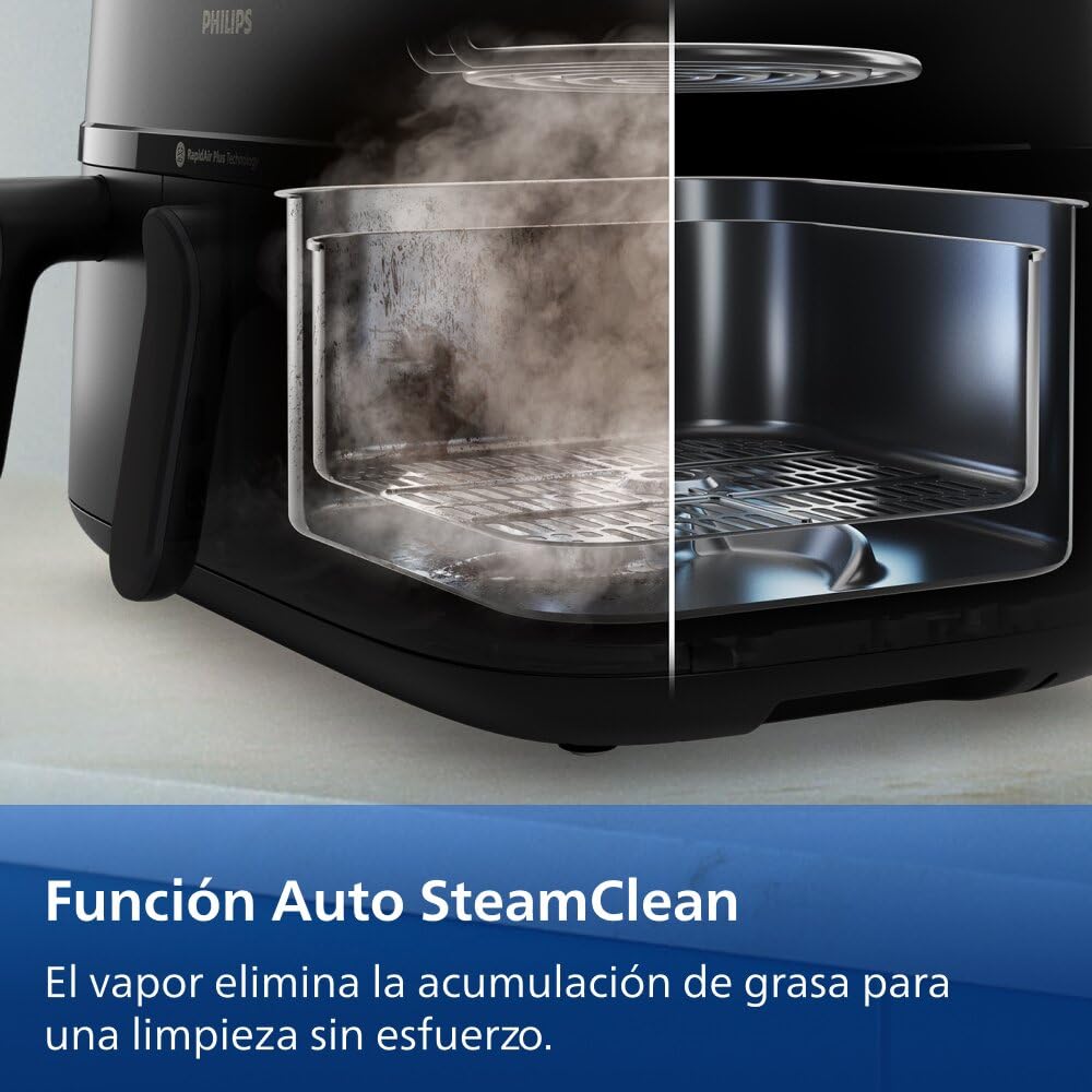 Detalle interior freidora Philips Dual Basket mostrando función Auto SteamClean antes y después de la limpieza con vapor.