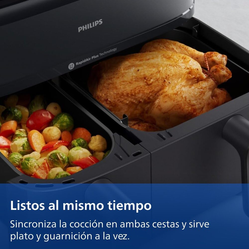 Philips Airfryer Dual Basket cocinando pollo asado y verduras al mismo tiempo en sus dos cestos.