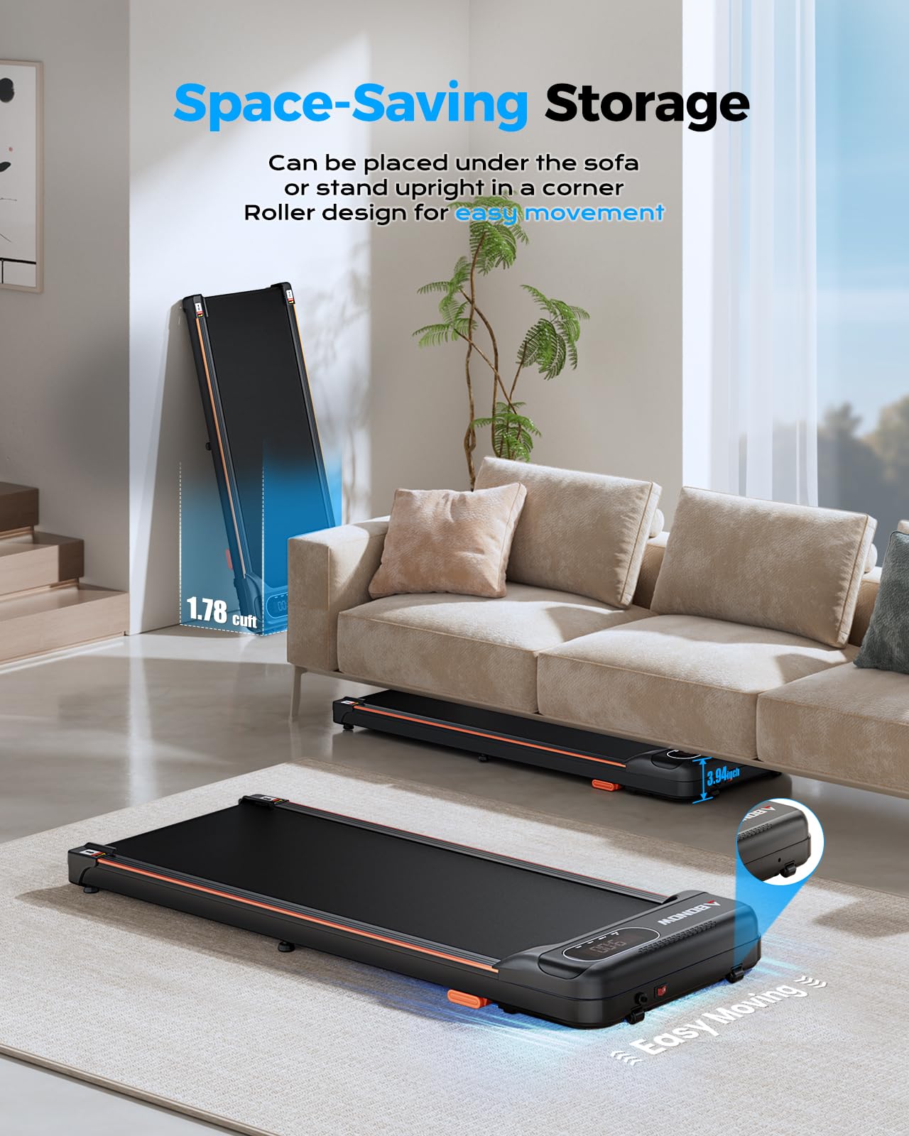 Compact black walking pad with orange accents shown stored under a sofa and standing upright in a living room corner.