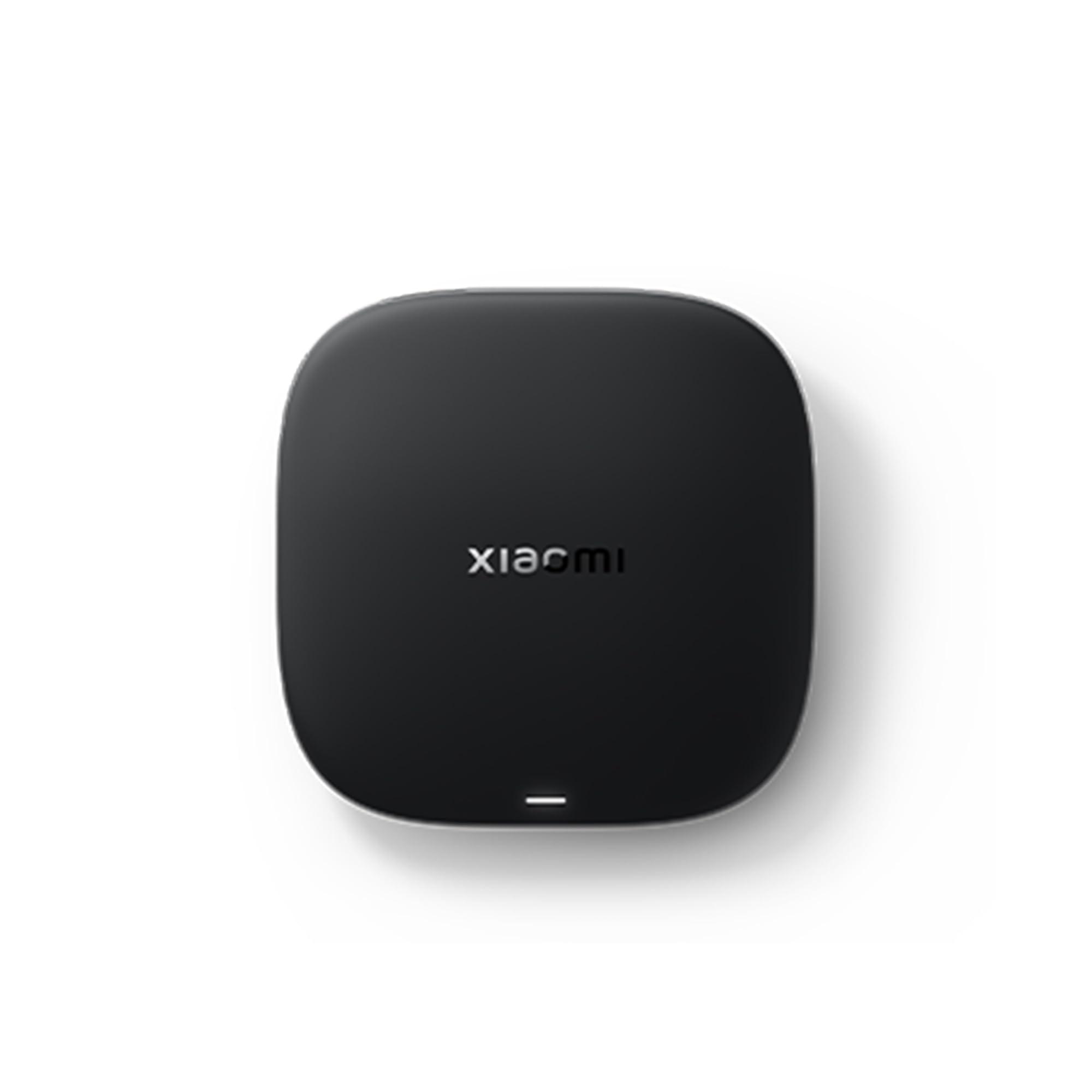 Xiaomi TV Box S negro sobre fondo blanco, vista cenital.