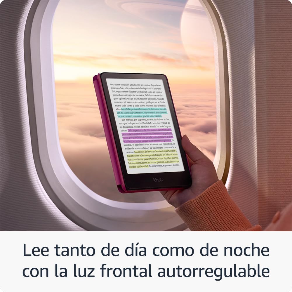 Mano sosteniendo un Kindle a color junto a la ventanilla de un avión.