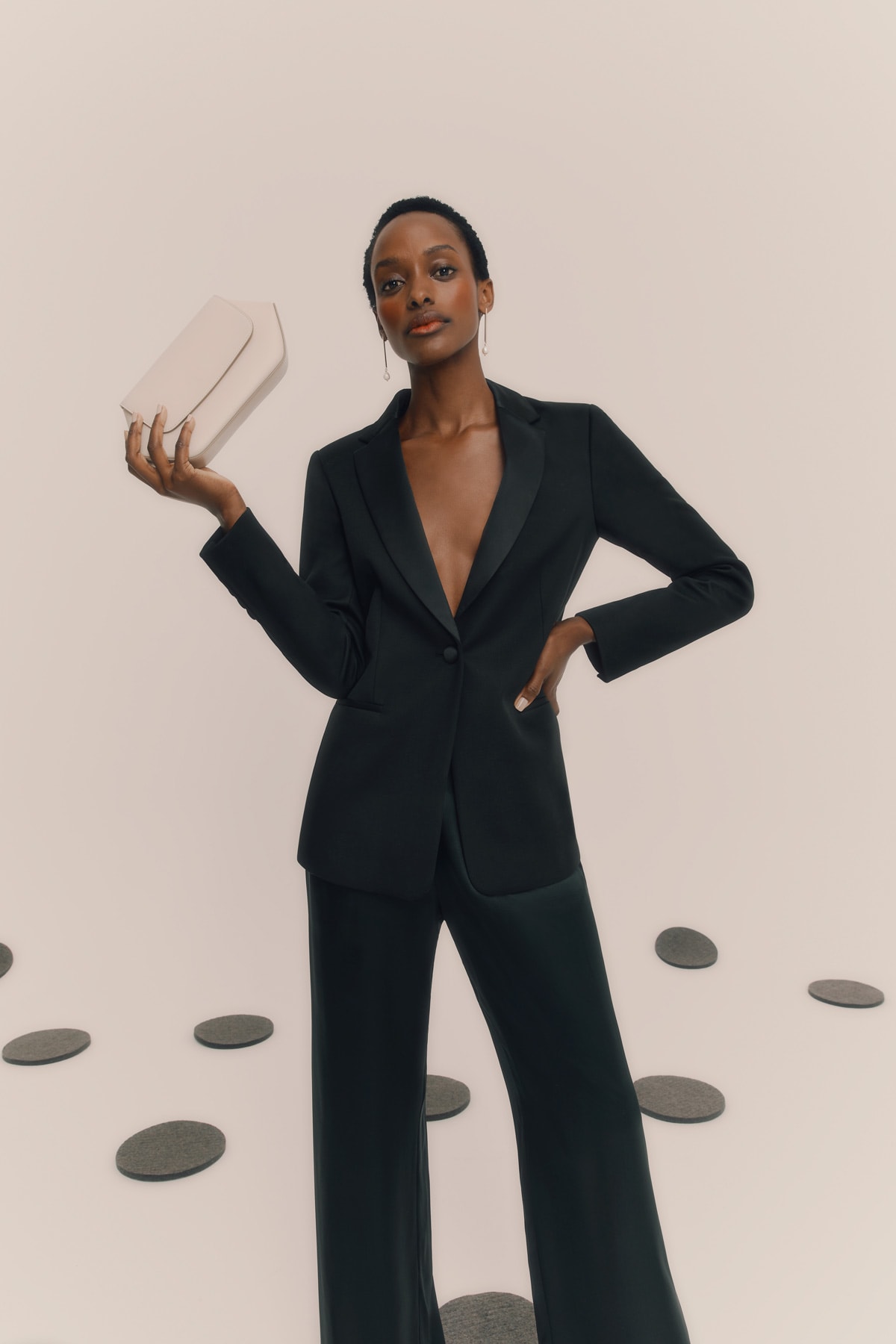 woman holding leather bag