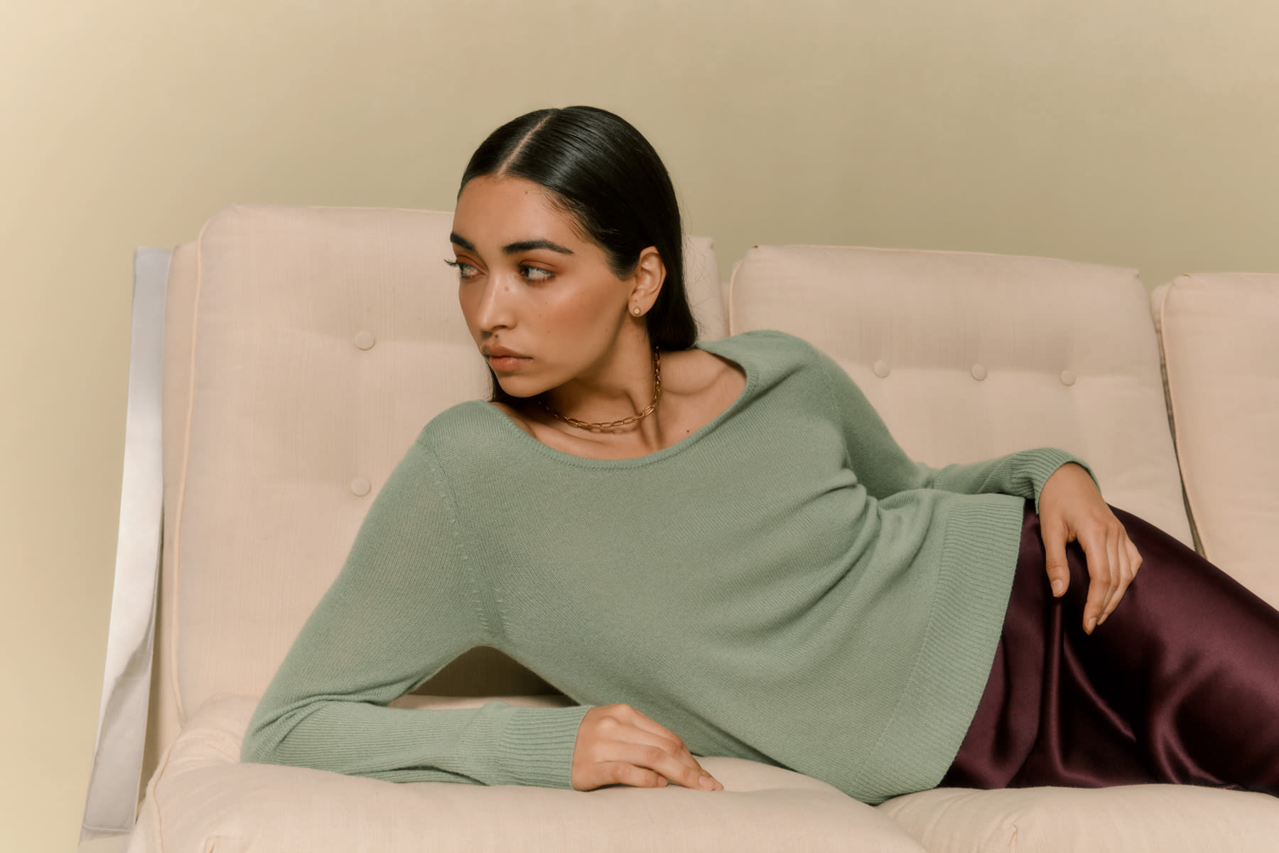 model posing on couch