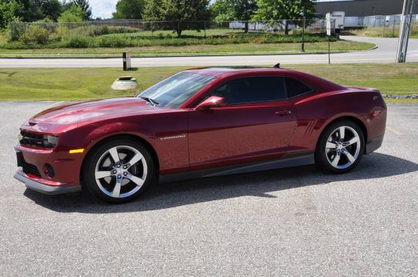 Red Chevrolet Camaro SS with tinted side windows