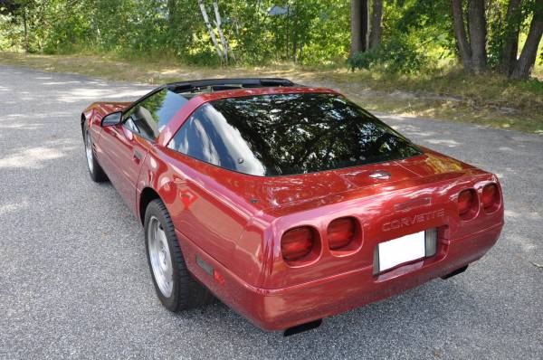 Red Chevrolet Corvette coupe with tinted rear glass