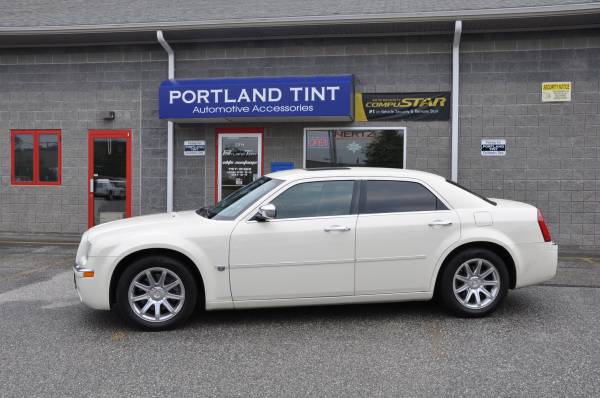 White Chrysler 300 sedan with tinted windows outside Portland Tint