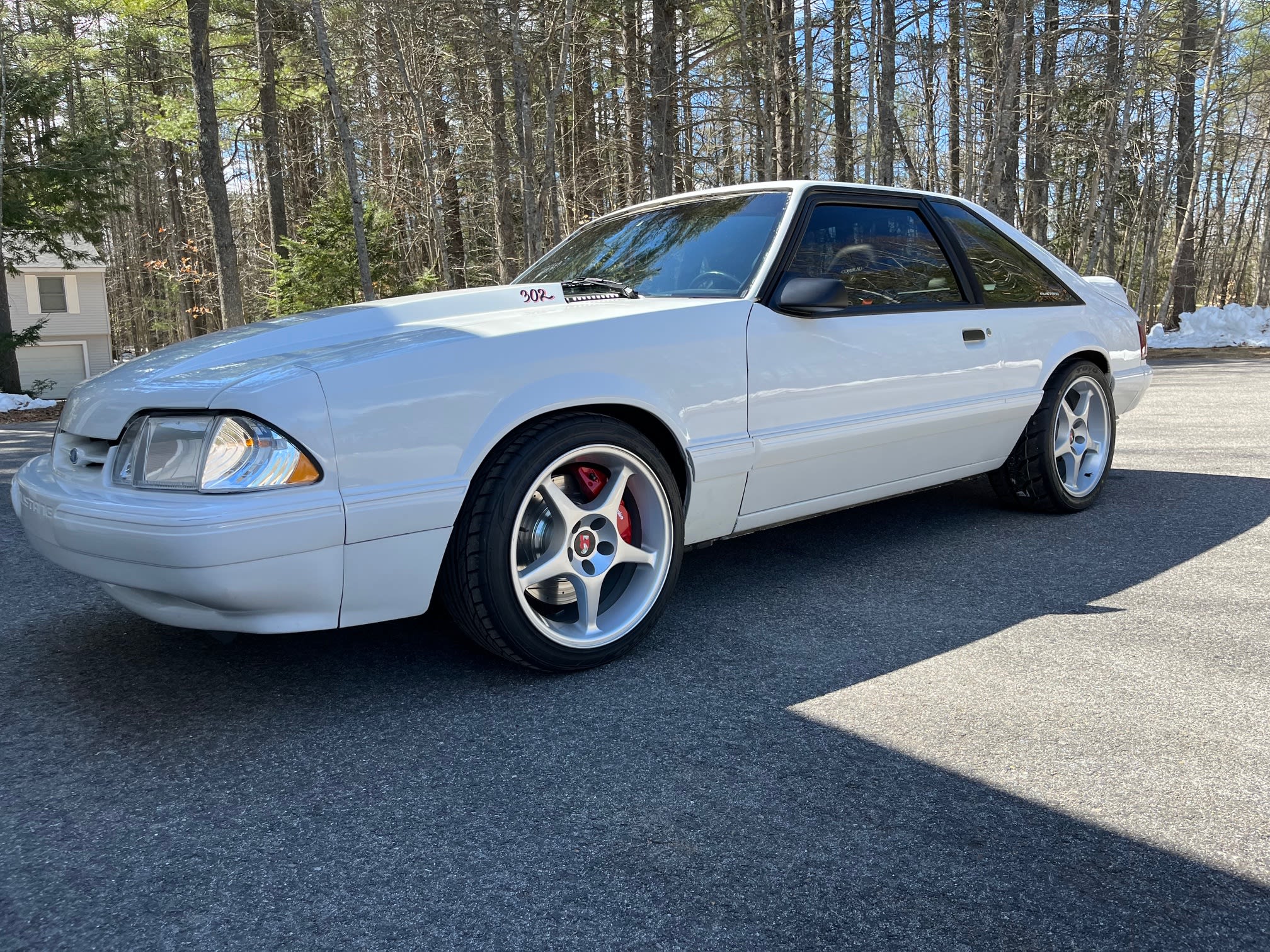 White Fox-body Ford Mustang with tinted rear windows