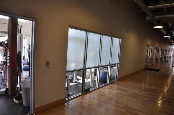 Frosted privacy window film on gym interior glass wall