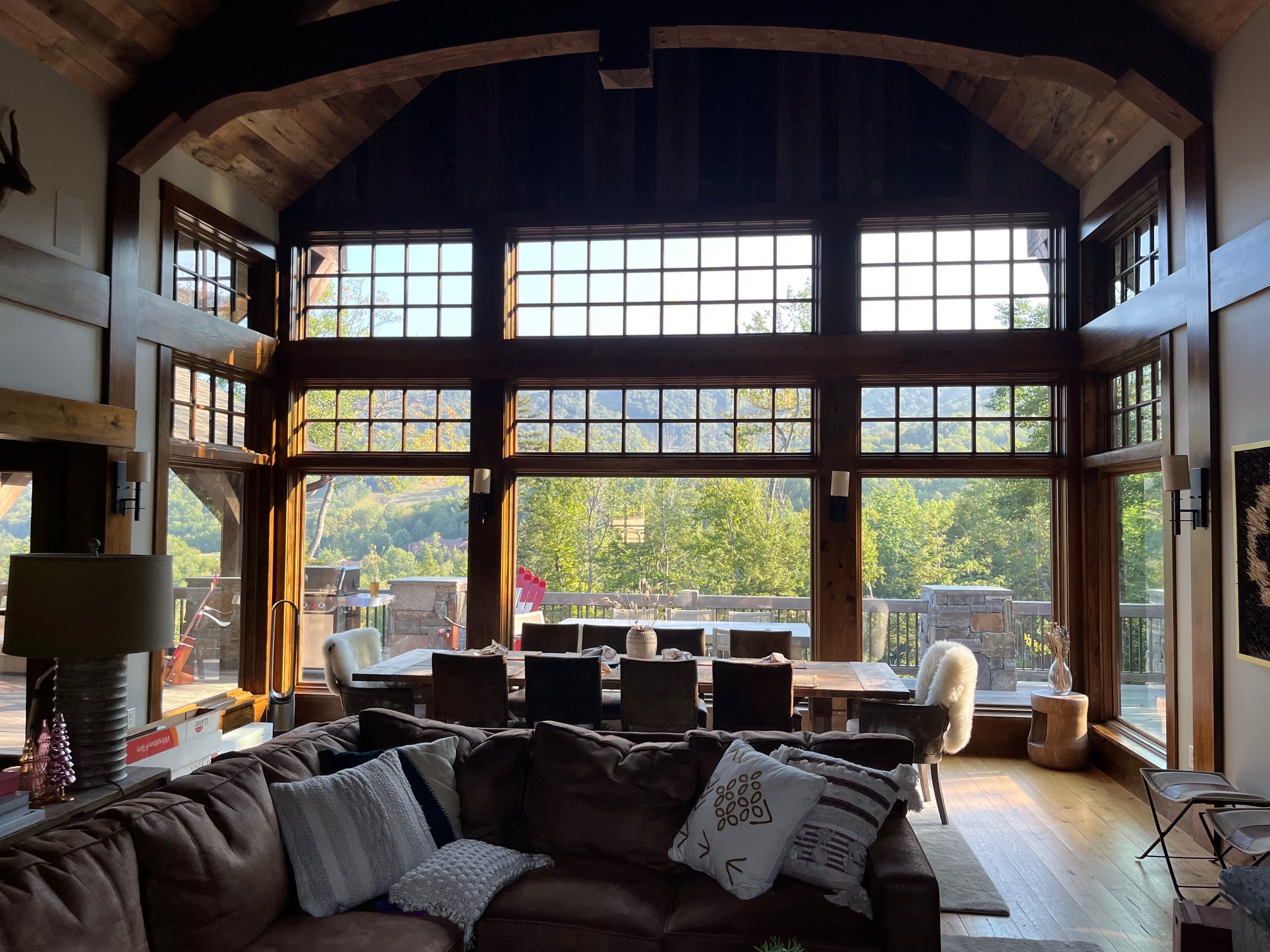 Home great room with large windows and film for glare control