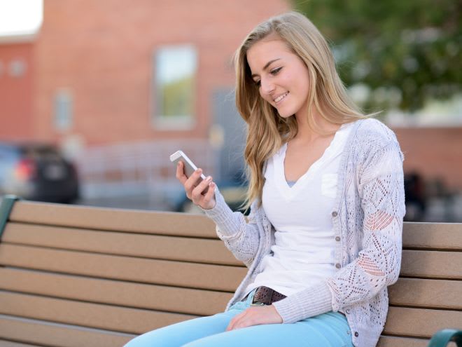 Person receiving an auto text reminder