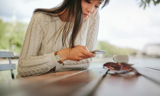 Woman reading text message