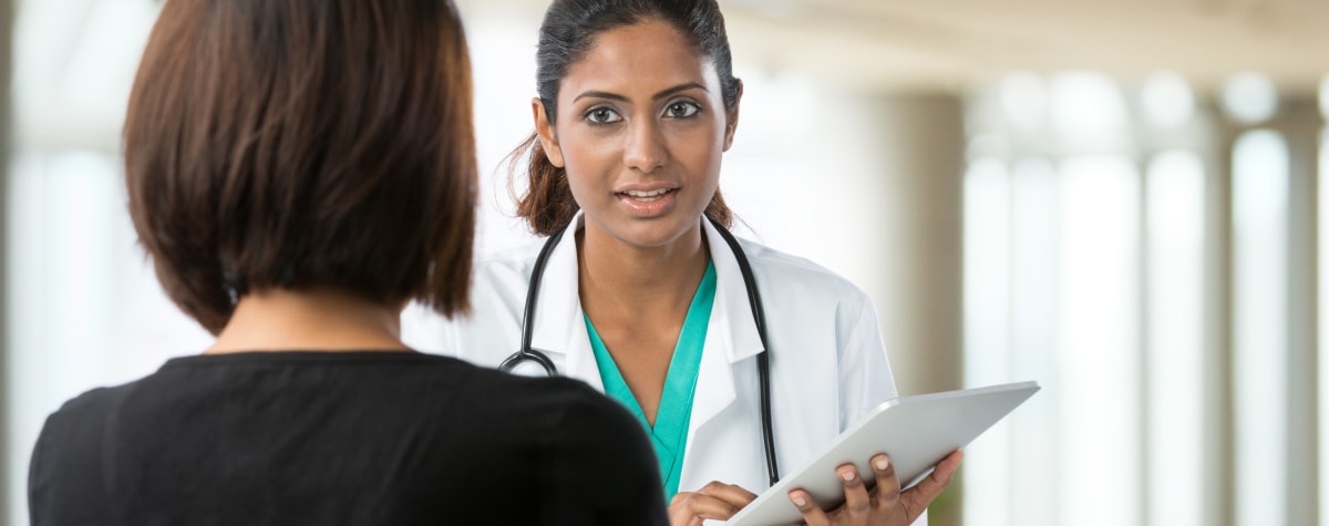 Doctor helping patient