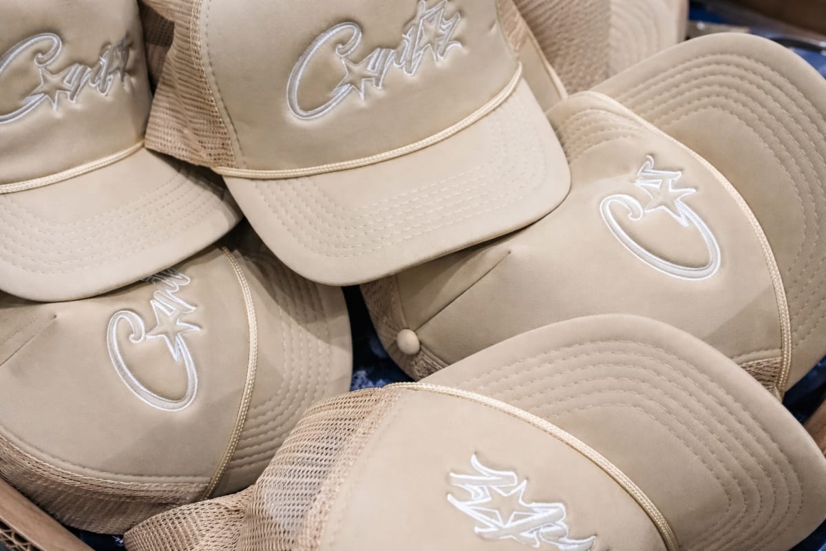 Stack of beige embroidered caps