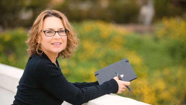Carolyn Ziel — Professional woman with tablet outdoors