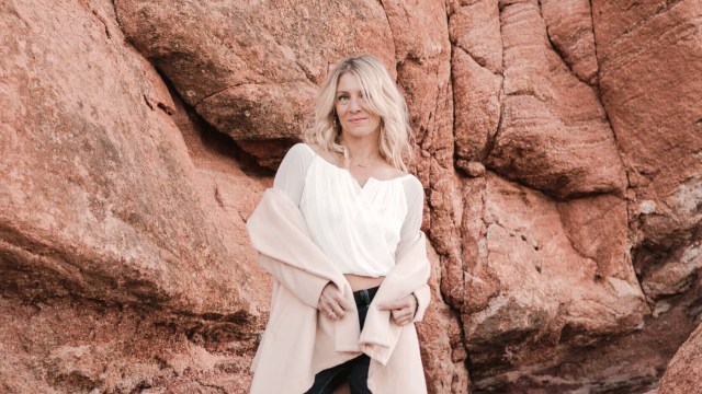 Emyrald Sinclaire — Blonde woman posed at rock formation